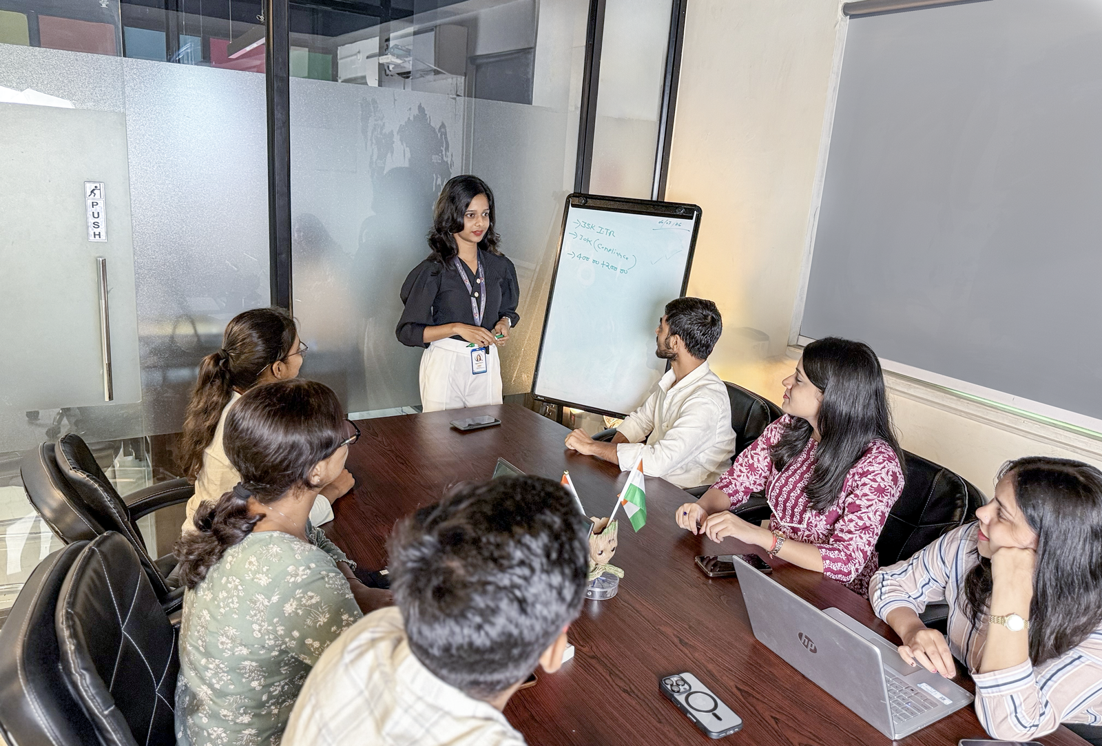 Adver Digify digital marketing team discussing SEO, Google Ads and website development strategies with clients in a business meeting